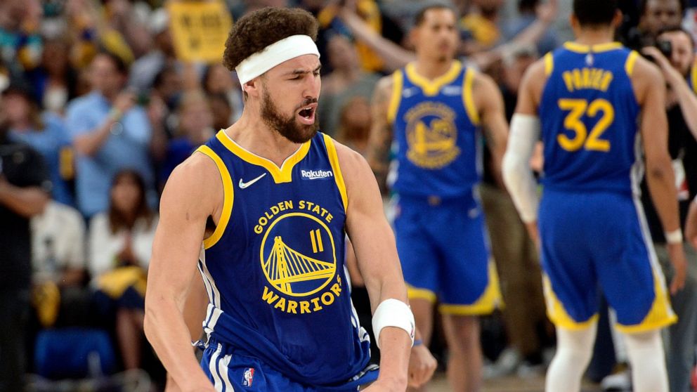 Golden State Warriors guard Klay Thompson (11) reacts after a win over the Memphis Grizzlies during Game 1 of a second-round NBA basketball playoff series Sunday, May 1, 2022, in Memphis, Tenn. (AP Photo/Brandon Dill)