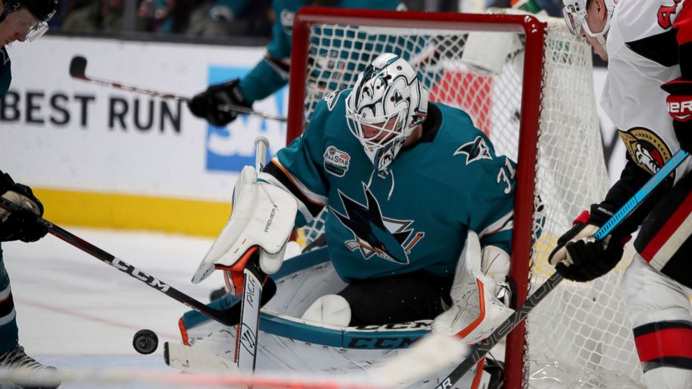 San Jose Sharks goaltender Martin Jones (31) blocks an Ottawa Senators shot during the second period of an NHL hockey game in San Jose, Calif., Saturday, Jan. 12, 2019. (AP Photo/Scot Tucker)