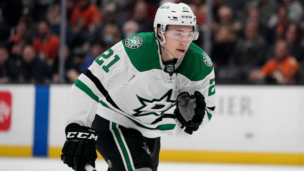 FILE - Dallas Stars' Jason Robertson skates during the third period of an NHL hockey game against the Anaheim Ducks Tuesday, March 29, 2022, in Anaheim, Calif. Young 40-goal scorer Jason Robertson is expected to miss the start of training camp for th