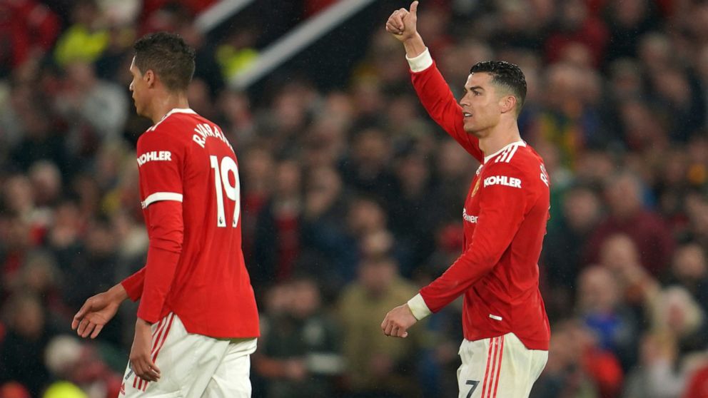 Manchester United's Cristiano Ronaldo, right, reacts during the English Premier League soccer match between Manchester United and Brentford at Old Trafford Stadium in Manchester, England, Monday, May 2, 2022. (AP Photo/Jon Super)