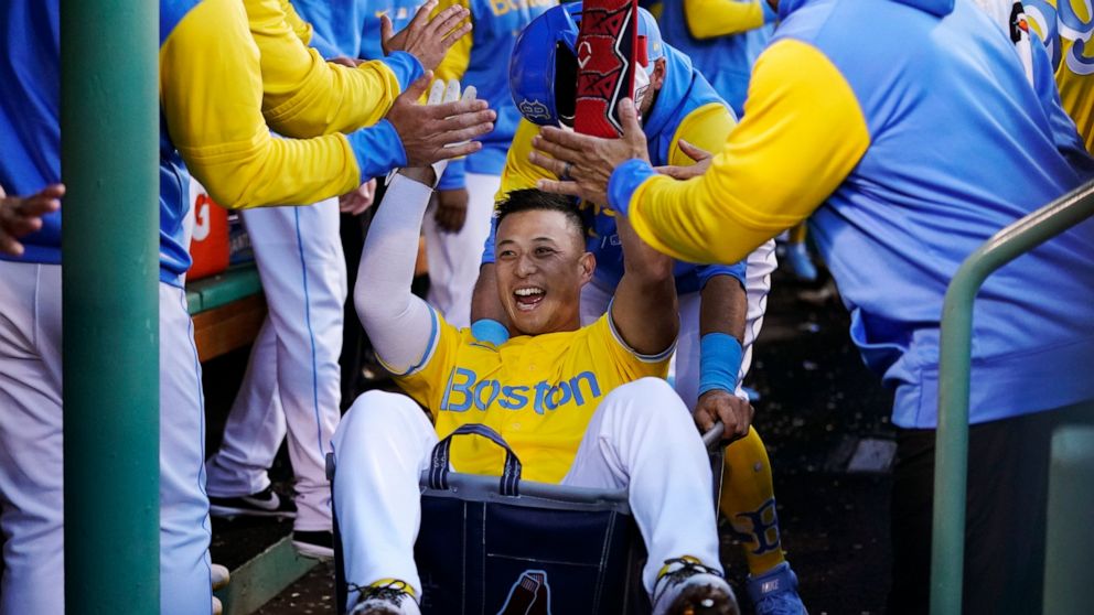 Boston Red Sox's Rob Refsnyder celebrates after his two run home run during the third inning of a baseball game against the Detroit Tigers, Wednesday, June 22, 2022, at Fenway Park in Boston. (AP Photo/Charles Krupa)