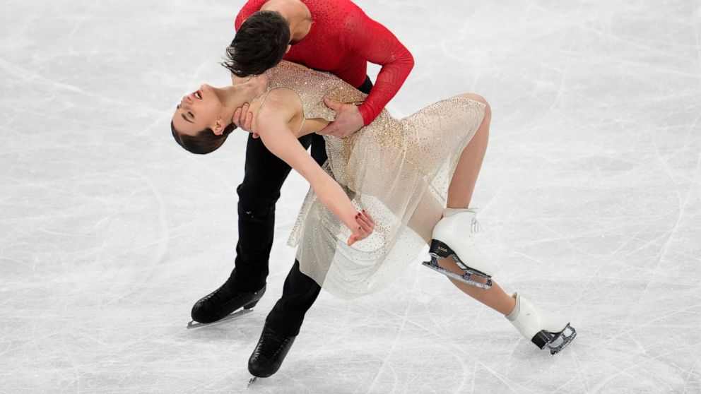 Gabriella Papadakis and Guillaume Cizeron, of France, perform their routine in the ice dance competition during the figure skating at the 2022 Winter Olympics, Monday, Feb. 14, 2022, in Beijing. (AP Photo/Natacha Pisarenko)