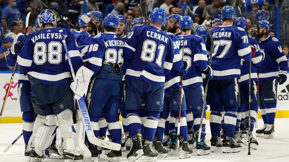 Tampa Bay Lightning goaltender Andrei Vasilevskiy (88) celebrates with his teammates after the team defeated the New York Rangers during Game 4 of the NHL hockey Stanley Cup playoffs Eastern Conference finals Tuesday, June 7, 2022, in Tampa, Fla. (AP