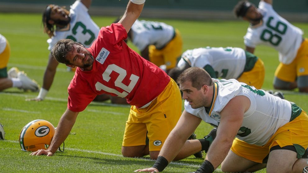 Green Bay Packers' Aaron Rodgers stretches during NFL football training camp Thursday, July 25, 2019, in Green Bay, Wis. (AP Photo/Morry Gash)