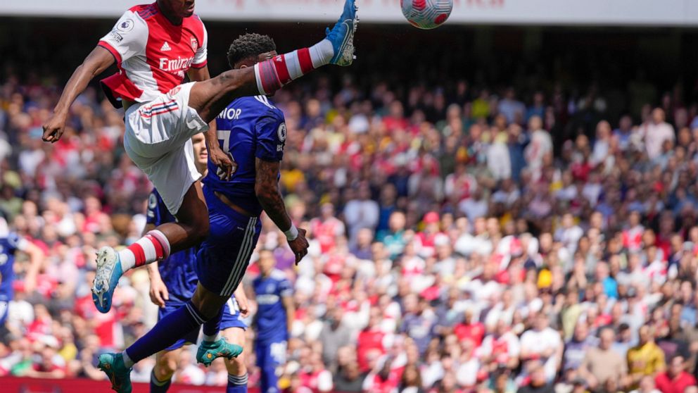 Arsenal's Eddie Nketiah, left, controls the ball during the English Premier League soccer match between Arsenal and Leeds United at the Emirates Stadium, in London Sunday, May 8, 2022. (AP Photo/Frank Augstein)
