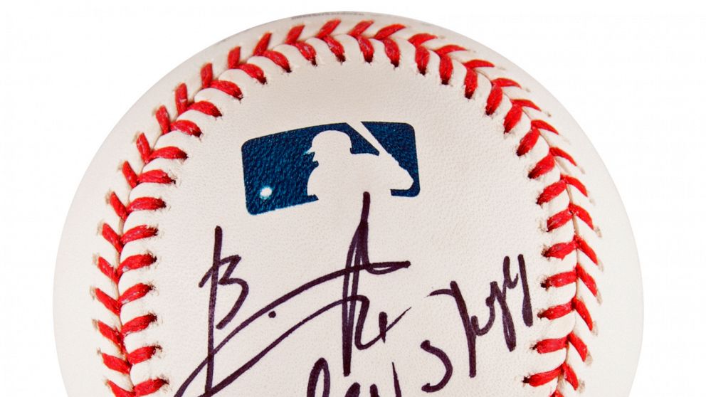This image provided by RR Auction shows a baseball signed by Ukrainian President Volodymyr Zelenskyy. The official Rawlings Major League baseball is being sold by Randy Kaplan, the renowned collector of balls that have been signed by world leaders, w
