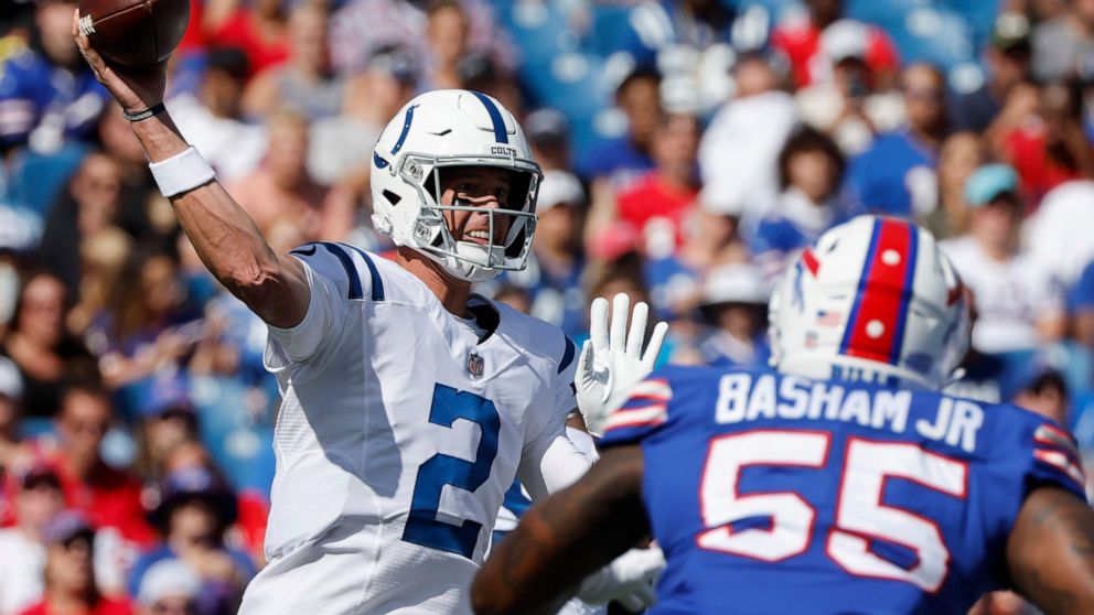 Indianapolis Colts quarterback Matt Ryan (2) passes under pressure from Buffalo Bills defensive end Boogie Basham (55) during the first half of a preseason NFL football game, Saturday, Aug. 13, 2022, in Orchard Park, N.Y. (AP Photo/Jeffrey T. Barnes)
