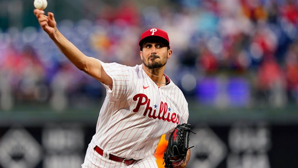 FILE - Philadelphia Phillies' Zach Eflin pitches during the first inning of the team's baseball game against the Colorado Rockies, April 26, 2022, in Philadelphia. Eflin has agreed to join the Tampa Bay Rays on a three-year, $40 million contract that