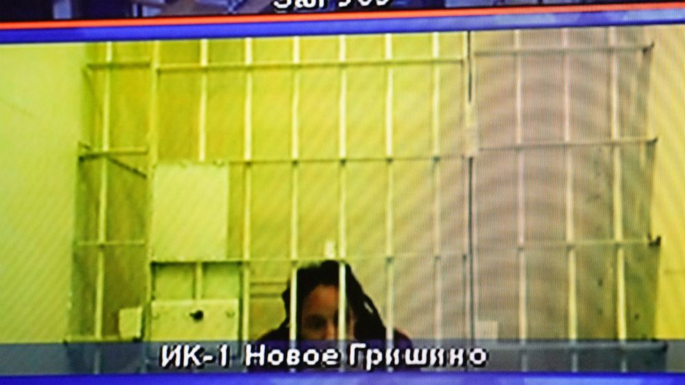 WNBA star and two-time Olympic gold medalist Brittney Griner is seen on the bottom part of a TV screen as she waits to appear in a video link provided by the Russian Federal Penitentiary Service a courtroom prior to a hearing at the Moscow Regional C