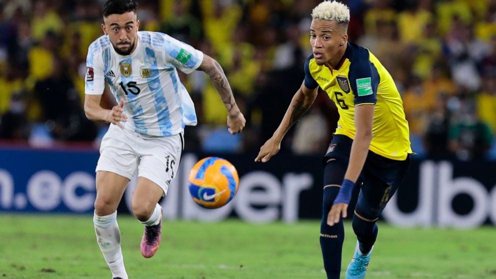 FILE - Ecuador's Byron Castillo, right, and Argentina's Nicolas Gonzalez eye the ball during a qualifying soccer match for the FIFA World Cup Qatar 2022 at Monumental Banco Pichincha stadium in Guayaquil, Ecuador, on March 29, 2022. Ecuador has kept 