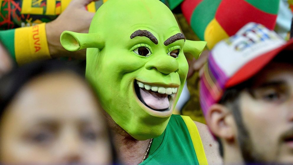 A Lithuanian fan wearing a Shrek mask watches the FIBA EuroBasket 2022 group B stage match between Slovenia and Lithuania in Cologne, Germany, Thursday, Sept. 1, 2022. (Zsolt Czegledi/MTI via AP)