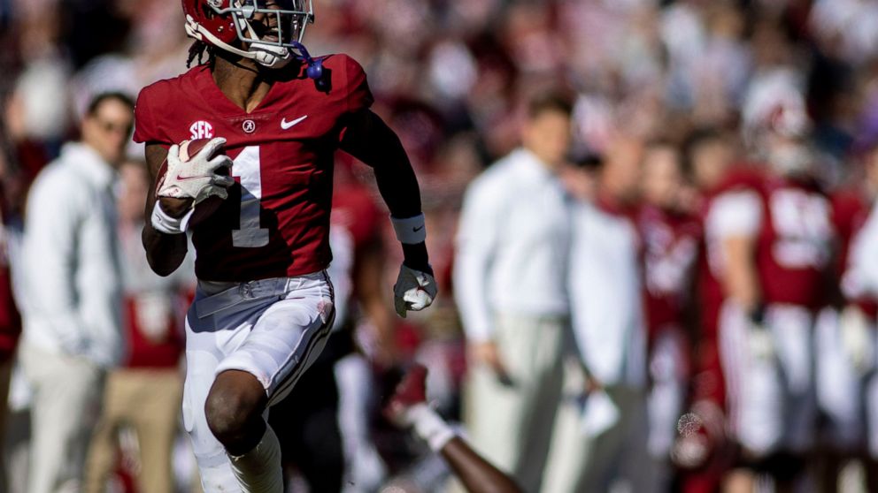 Alabama wide receiver Jameson Williams (1) runs down the sideline on a long pass reception against New Mexico State during the first half of an NCAA college football game, Saturday, Nov. 13, 2021, in Tuscaloosa, Ala. (AP Photo/Vasha Hunt)