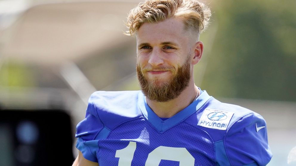 Los Angeles Rams wide receiver Cooper Kupp smiles during stretching at the NFL football team's practice facility, Thursday, May 26, 2022, in Thousand Oaks, Calif. (AP Photo/Marcio Jose Sanchez)