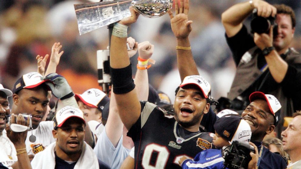FILE - New England Patriots' Richard Seymour (93) holds the Vince Lombardi trophy after the Patriots defeated the Carolina Panthers 32-29 to win Super Bowl XXXVIII on Feb. 1, 2004, in Houston. Seymour's winning start in New England is a good starting