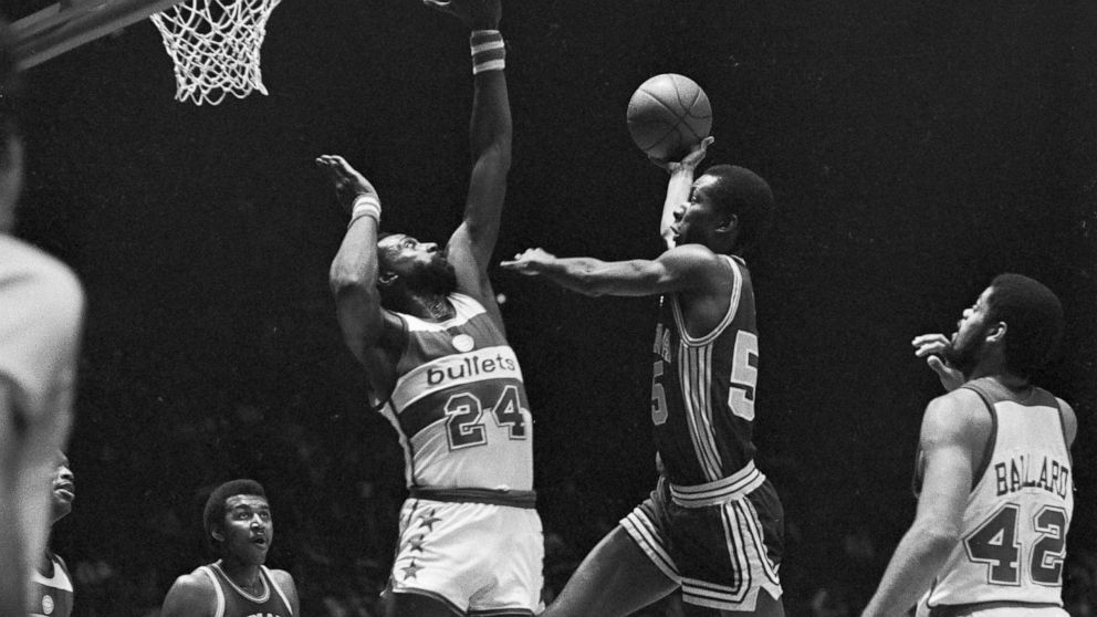 FILE - Indiana Pacers' Louis Orr drives to the basket as Washington Bullets' Spencer Haywood (24) goes for the block during second quarter action at the Capital Center in Landover, Md., Dec. 26, 1981. Haywood knocked the ball away, into the hands of 