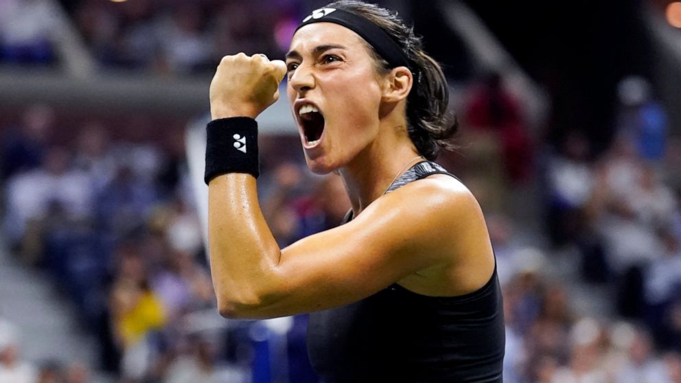 Caroline Garcia, of France, celebrates after winning a point against Coco Gauff, of the United States, during the quarterfinals of the U.S. Open tennis championships, Tuesday, Sept. 6, 2022, in New York. (AP Photo/Charles Krupa)