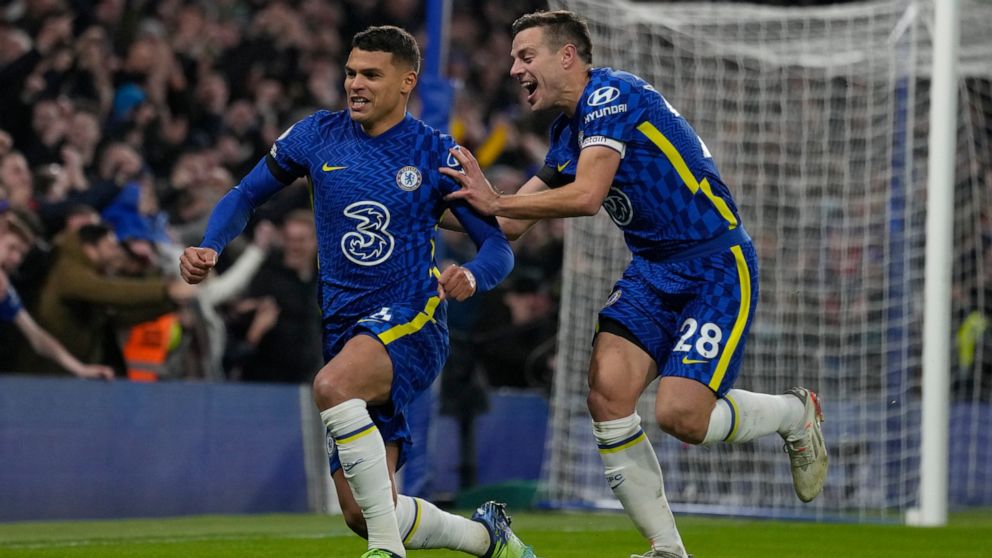 Chelsea's Thiago Silva, left, celebrates after scoring his side's second goal during the English Premier League soccer match between Chelsea and Tottenham Hotspur at Stamford Bridge stadium in London, England, Sunday, Jan. 23, 2022. (AP Photo/Kirsty 