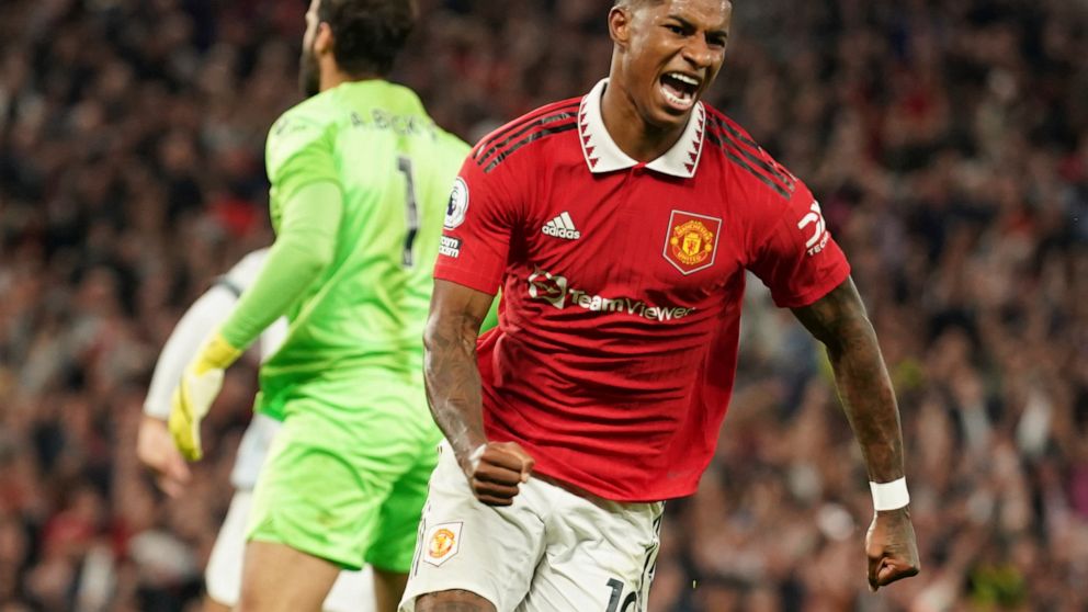 Manchester United's Marcus Rashford celebrates after scoring his side's second goal during the English Premier League soccer match between Manchester United and Liverpool at Old Trafford stadium, in Manchester, England, Monday, Aug 22, 2022. (AP Phot