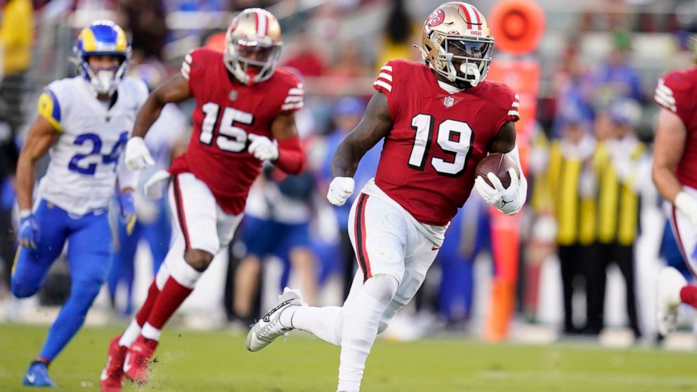 San Francisco 49ers wide receiver Deebo Samuel (19) runs toward the end zone to score against the Los Angeles Rams during the first half of an NFL football game in Santa Clara, Calif., Monday, Oct. 3, 2022. (AP Photo/Godofredo A. Vásquez)