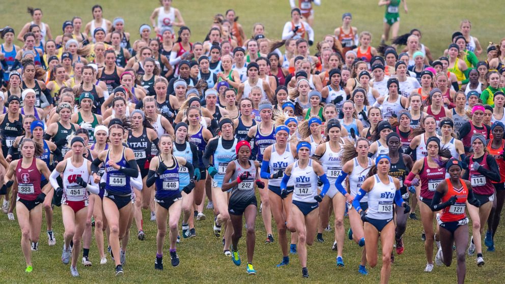 FILE - The field of runners compete in the women's NCAA Division I Cross-Country Championships, Saturday, Nov. 23, 2019, in Terre Haute, Ind. The pandemic shutdown created financial pressures, particularly for Division I programs with lost revenue fr