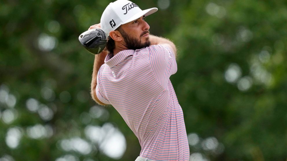 Max Homa watches his shot on the 10th hole during the first round of the U.S. Open golf tournament at The Country Club, Thursday, June 16, 2022, in Brookline, Mass. (AP Photo/Charlie Riedel)