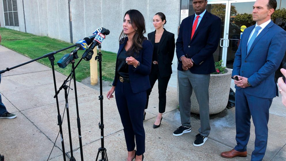 Attorney Alexandra Benevento, center, speaks with reporters during a news conference announcing a cheerleader abuse lawsuit filed in Tennessee on Tuesday, Sept. 27, 2022, in Memphis, Tenn. (AP Photo/Adrian Sainz)