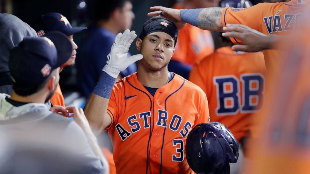 Houston Astros' Jeremy Pena (3) is congratulated in the dugout after his home run against the Los Angeles Angels during the sixth inning of a baseball game Friday, Sept. 9, 2022, in Houston. (AP Photo/Michael Wyke)
