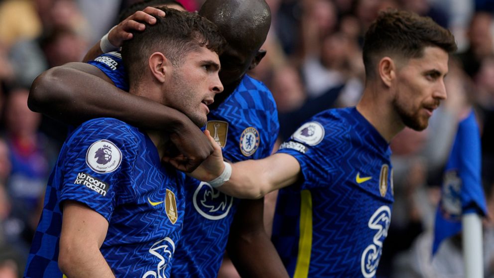 Chelsea's Christian Pulisic, left, celebrates with teammates after scoring the only goal of the game during the English Premier League soccer match between Chelsea and West Ham United at Stamford Bridge in London, Sunday, April 24, 2022. Chelsea won 