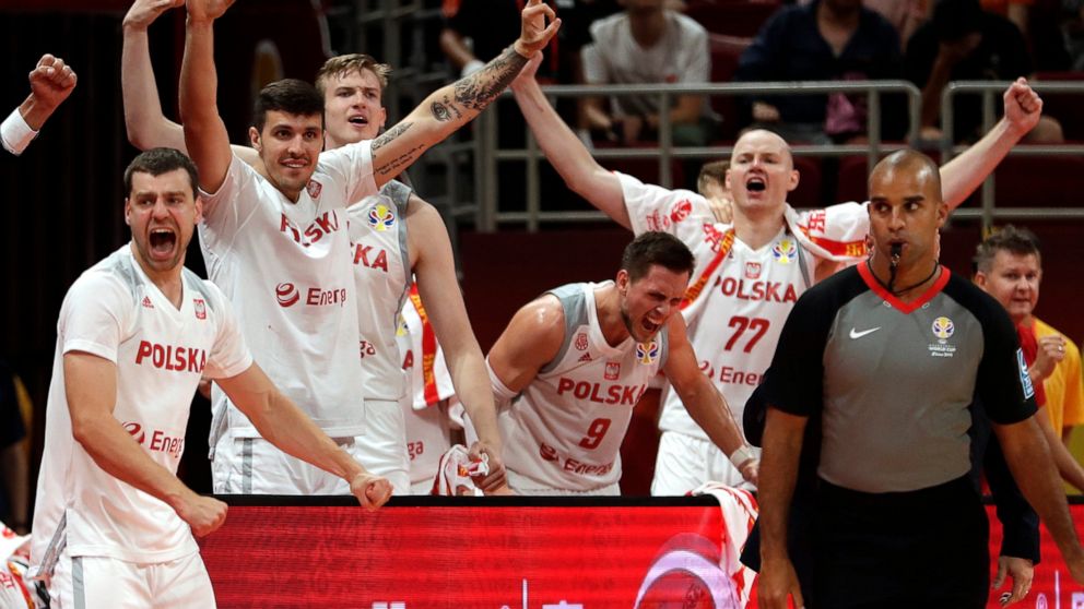 Poland's bench reacts during their group phase basketball game against Venezuela in the FIBA Basketball World Cup at the Cadillac Arena in Beijing, Saturday, Aug. 31, 2019. (AP Photo/Mark Schiefelbein)