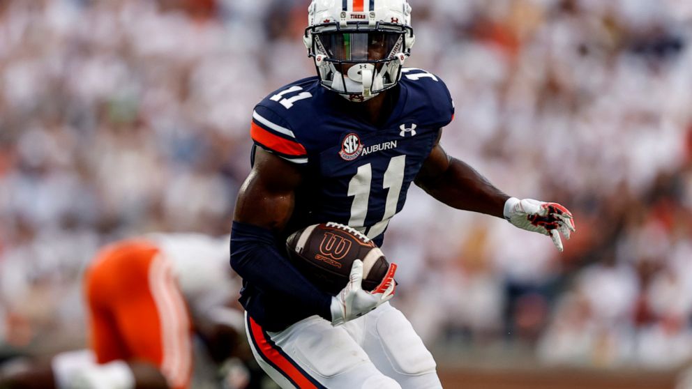 Auburn wide receiver Shedrick Jackson carries the ball against Mercer during the first half of an NCAA college football game Saturday, Sept. 3, 2022, in Auburn, Ala. (AP Photo/Butch Dill)