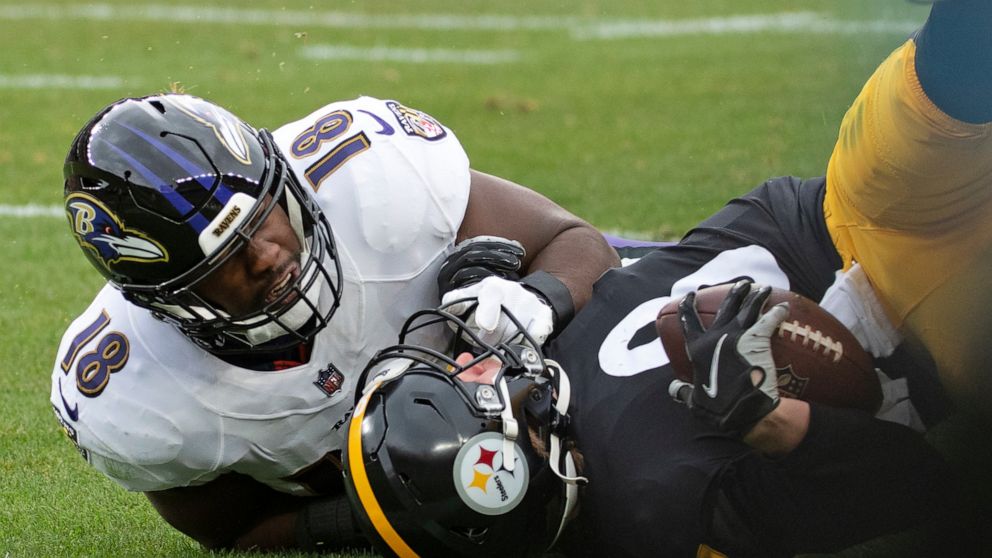 Pittsburgh Steelers quarterback Kenny Pickett (8) is tackled by Baltimore Ravens linebacker Roquan Smith (18) during the first half of an NFL football game in Pittsburgh, Sunday, Dec. 11, 2022. Picket left the game under concussion protocol. (AP Phot