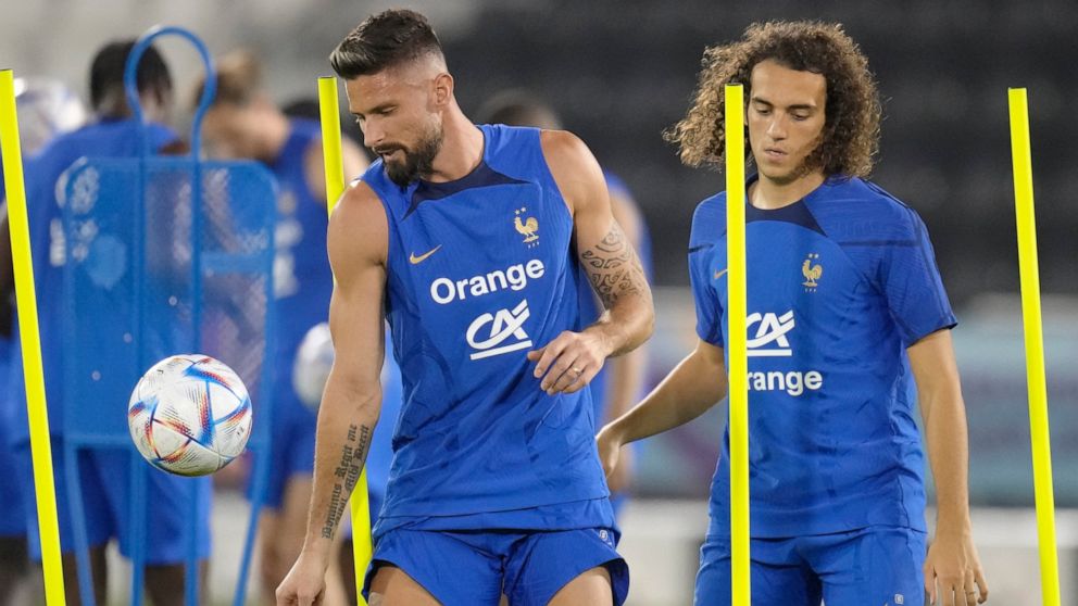 France's Olivier Giroud, left, and Matteo Guendouzi practise during a training session at the Jassim Bin Hamad stadium in Doha, Qatar, Saturday, Nov. 19, 2022. France will play their first match in the World Cup against Australia on Nov. 22. (AP Phot