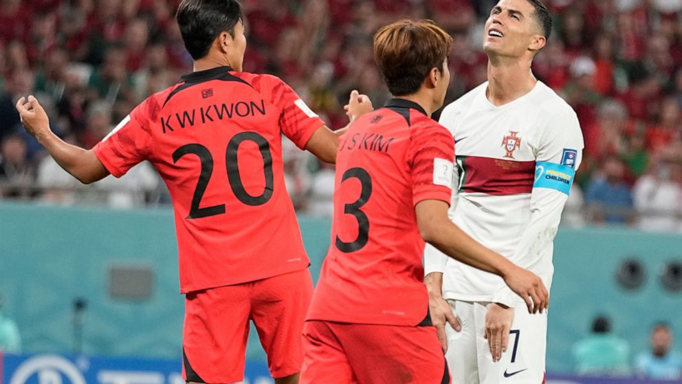 Portugal's Cristiano Ronaldo, right, reacts after missing an opportunity to score during the World Cup group H soccer match between South Korea and Portugal, at the Education City Stadium in Al Rayyan, Qatar, Friday, Dec. 2, 2022. (AP Photo/Ariel Schalit)