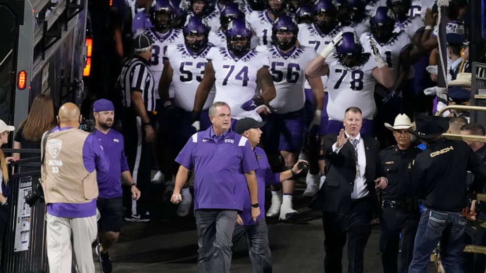 TCU coach Sonny Dykes leads the team onto the field for an NCAA college football game against Colorado on Friday, Sept. 2, 2022, in Boulder, Colo. (AP Photo/David Zalubowski)