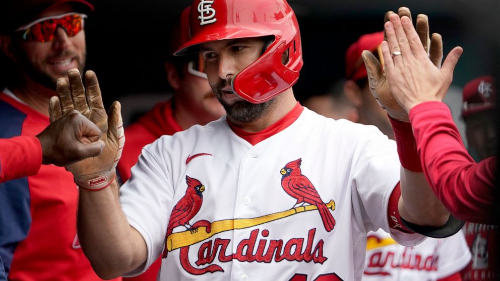 St. Louis Cardinals' Paul Goldschmidt is congratulated by teammates after hitting a solo home run during the first inning of a baseball game against the Kansas City Royals Monday, May 2, 2022, in St. Louis. (AP Photo/Jeff Roberson)
