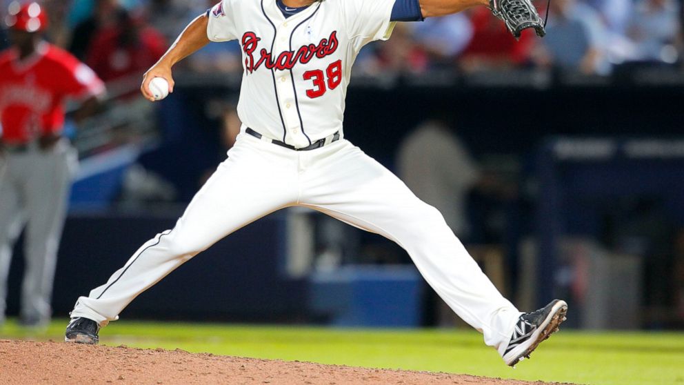 FILE - Atlanta Braves relief pitcher Anthony Varvaro delivers in the sixth inning of a baseball game against the Los Angeles Angels on June 15, 2014, in Atlanta. Varvaro, a former MLB pitcher who retired in 2016 to become a police officer in the New 