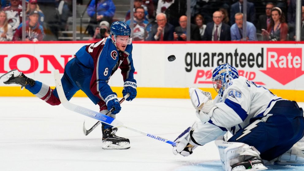 Colorado Avalanche defenseman Cale Makar (8) shoots against Tampa Bay Lightning goaltender Andrei Vasilevskiy (88) during the second period in Game 5 of the NHL hockey Stanley Cup Final, Friday, June 24, 2022, in Denver. (AP Photo/Jack Dempsey)