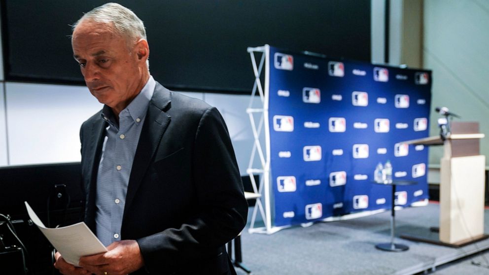 Major League Baseball commissioner Rob Manfred leaves after speaking at a news conference, Thursday March 10, 2022, in New York. Major League Baseball’s acrimonious lockout ended Thursday when a divided players’ association voted to accept management