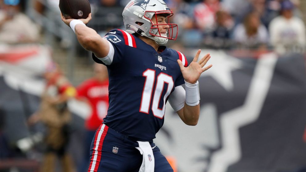 New England Patriots quarterback Mac Jones winds up to pass in the first half of an NFL football game against the Baltimore Ravens, Sunday, Sept. 25, 2022, in Foxborough, Mass. (AP Photo/Paul Connors)