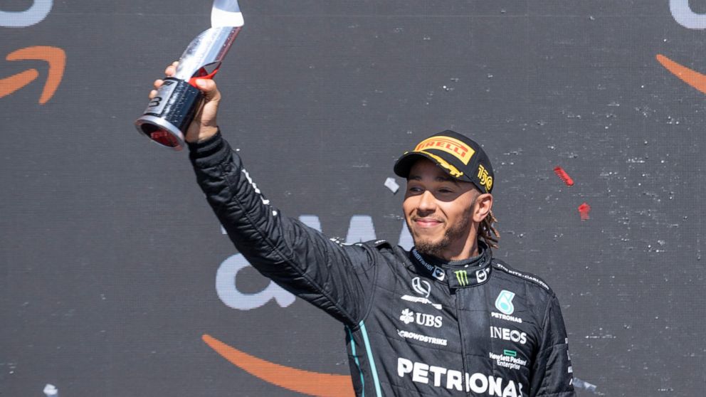 Mercedes Team driver Lewis Hamilton, of Great Britain, celebrates after taking third place at the Canadian Grand Prix in Montreal on Sunday, June 19, 2022. (Paul Chiasson/The Canadian Press via AP)