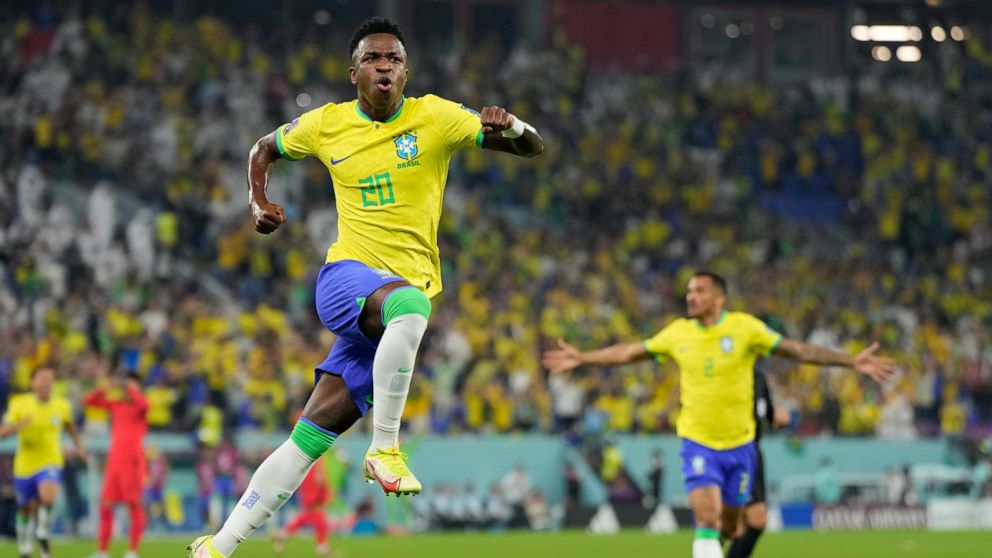 Brazil's Vinicius Junior celebrates after scoring his side's opening goal during the World Cup round of 16 soccer match between Brazil and South Korea at the Stadium 974 in Doha, Qatar, Monday, Dec. 5, 2022. (AP Photo/Jin-Man Lee)