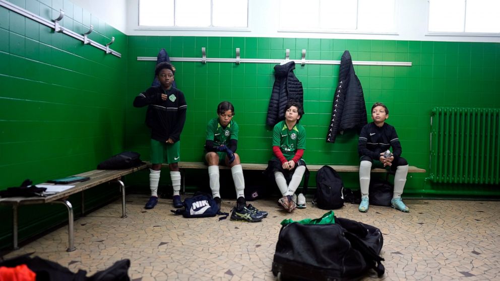 Players of the football club AS Bondy, where Kylian Mbappe played as a kid, prior to a match on the Leo Lagrange stadium in Bondy, east of Paris, Saturday, Dec. 17, 2022. On the football fields where Kylian Mbappe hones the feints, dribbles and shots