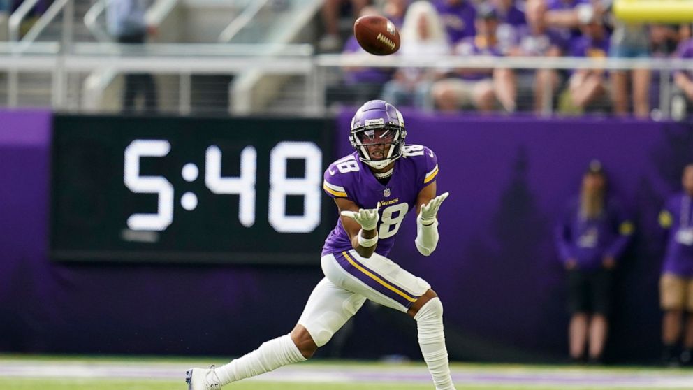 Minnesota Vikings wide receiver Justin Jefferson (18) catches a pass during the first half of an NFL football game against the Green Bay Packers, Sunday, Sept. 11, 2022, in Minneapolis. (AP Photo/Abbie Parr)