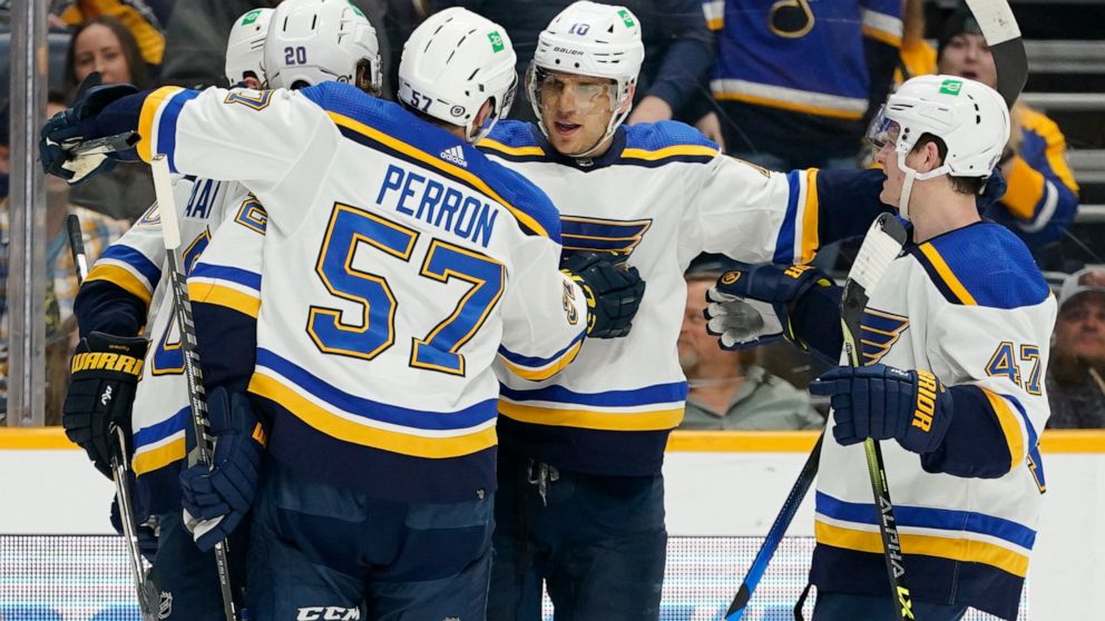 St. Louis Blues' Brayden Schenn (10) is congratulated after scoring a goal against the Nashville Predators in the first period of an NHL hockey game Sunday, April 17, 2022, in Nashville, Tenn. (AP Photo/Mark Humphrey)