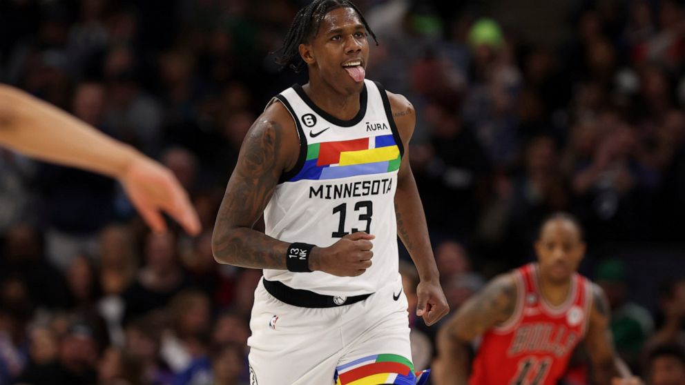 Minnesota Timberwolves forward Nathan Knight (13) reacts after making a basket during the first half of an NBA basketball game against the Chicago Bulls, Sunday, Dec. 18, 2022, in Minneapolis. (AP Photo/Stacy Bengs)