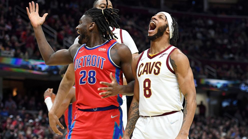 Cleveland Cavaliers' Lamar Stevens (8) celebrates a dunk against Detroit Pistons' Isaiah Stewart (28) during the first half of an NBA basketball game Saturday, March 19, 2022, in Cleveland. (AP Photo/Nick Cammett)