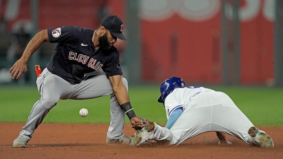 Kansas City Royals' Nate Eaton beats the tag by Cleveland Guardians shortstop Amed Rosario to steal second during the seventh inning of a baseball game Wednesday, Sept. 7, 2022, in Kansas City, Mo. (AP Photo/Charlie Riedel)