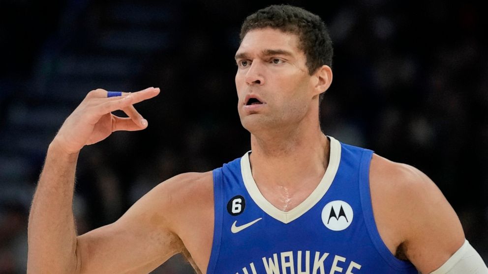 Milwaukee Bucks' Brook Lopez reacts after making a three-point basket during the first half of an NBA basketball game Wednesday, Nov. 16, 2022, in Milwaukee. (AP Photo/Morry Gash)