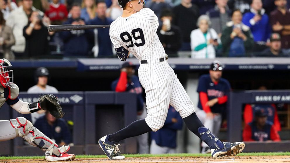 New York Yankees designated hitter Aaron Judge follows through on a double against Boston Red Sox starting pitcher Brayan Bello during the first inning of a baseball game Sunday, Sept. 25, 2022, in New York. (AP Photo/Jessie Alcheh)