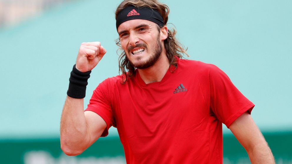 Stefanos Tsitsipas of Greece celebrates after defeating Daniel Evans of Britain in their semifinal match of the Monte Carlo Tennis Masters tournament in Monaco, Saturday, April 17, 2021. (AP Photo/Jean-Francois Badias)